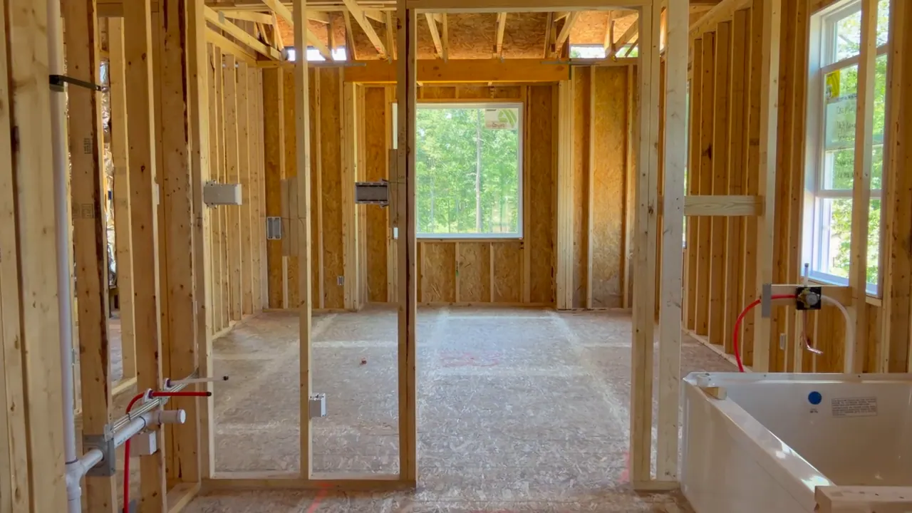 A room framed in timber studs, before lining.